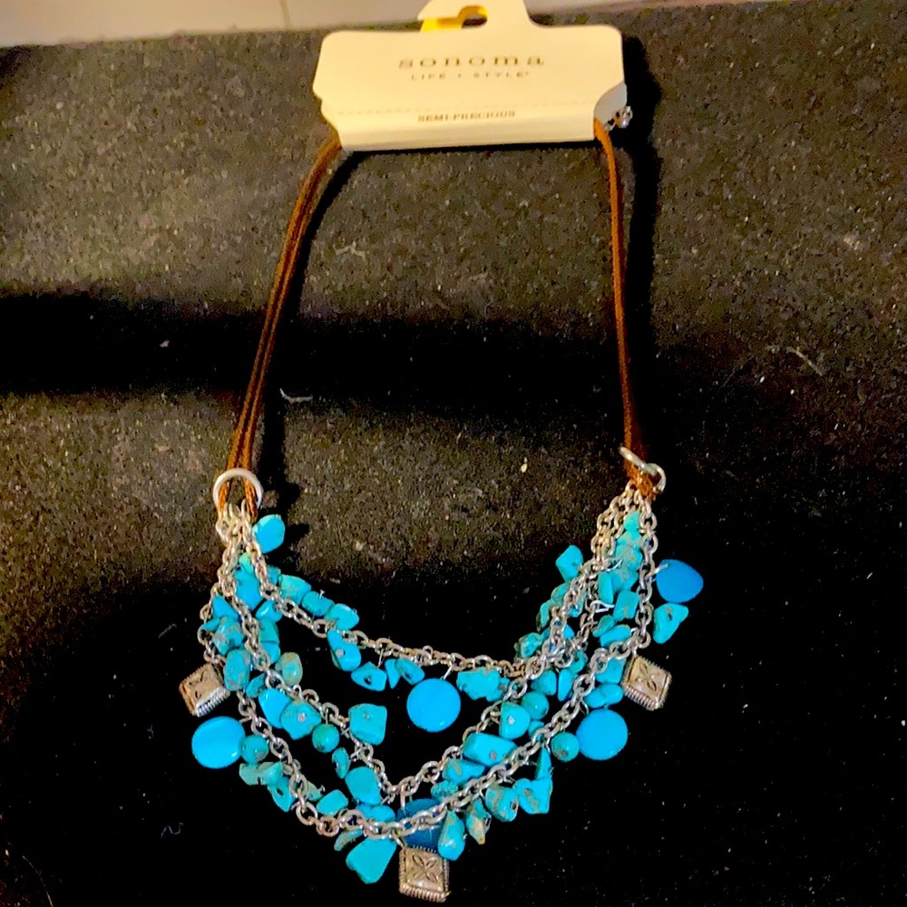 Sonoma necklace. Turquoise colored beads with silver chains and charms.